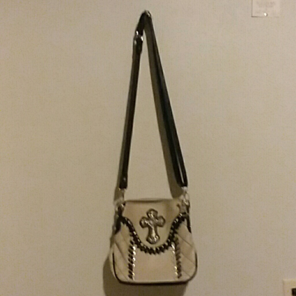 Cream and black, faux leather cross body bag.